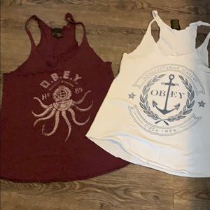 two women’s obey tanks